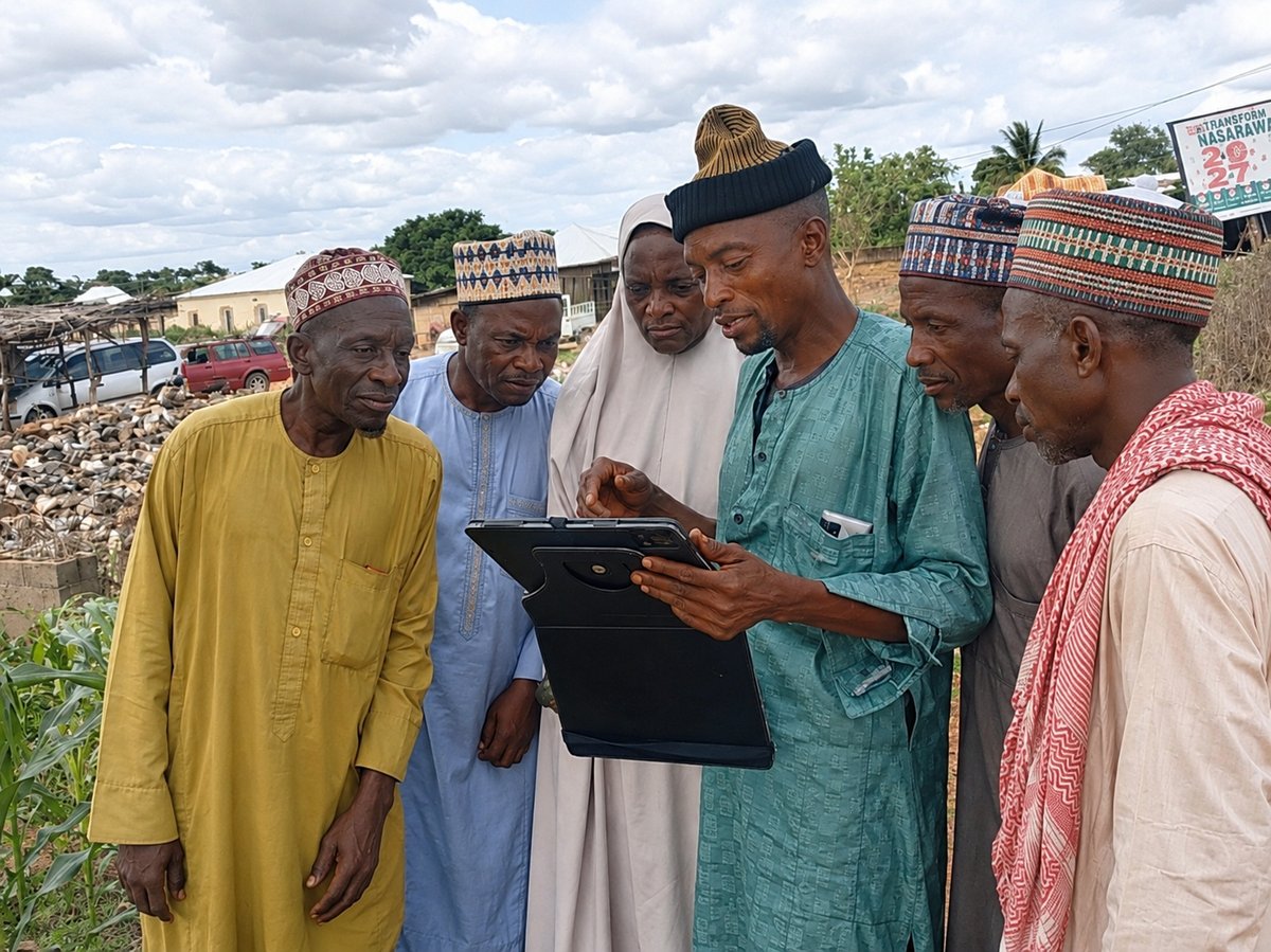 Community Huddle Around a Tablet